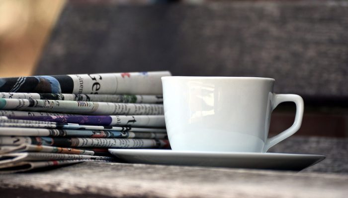 cup, newspapers, magazines